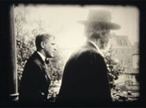 Rear view image of Andrew Taylor Still on a balcony with student