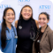 Three people smiling for photo