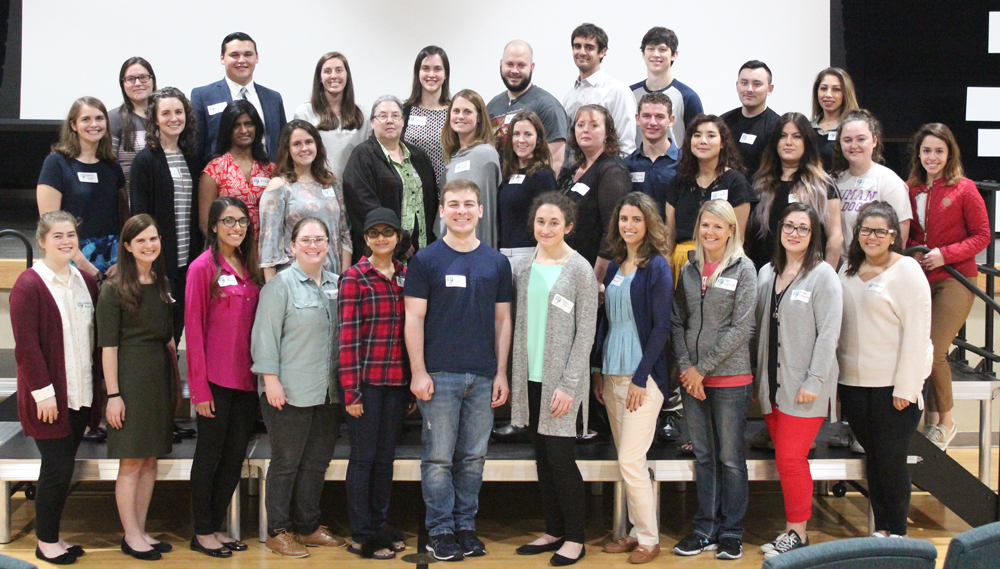 rows of students in the scholars program posing for a group photo