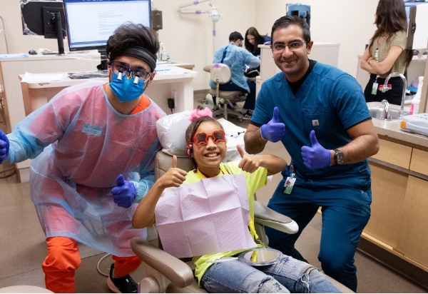 Doctors with a happy patient