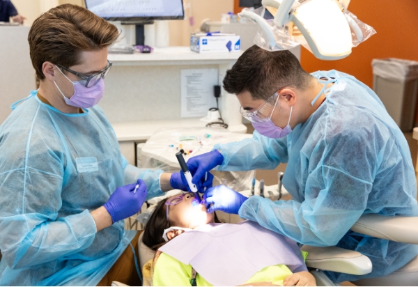 Doctors with a happy patient