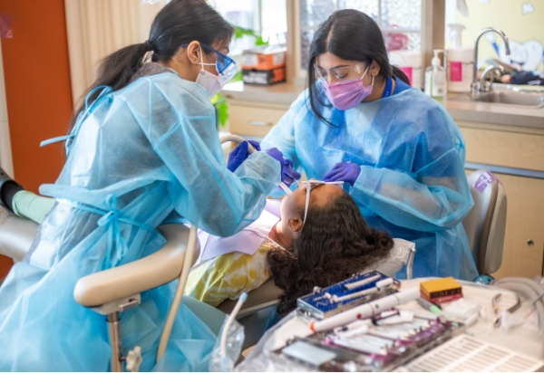 Doctors with a happy patient