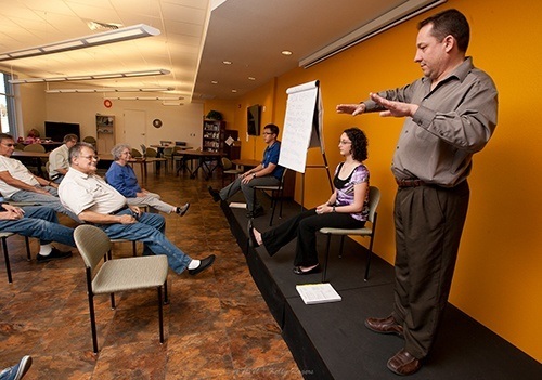 Three ATSU Audiology students giving a presentation.