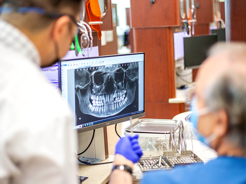 Dentists looking at xray