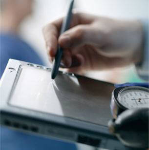 doctor writing on tablet