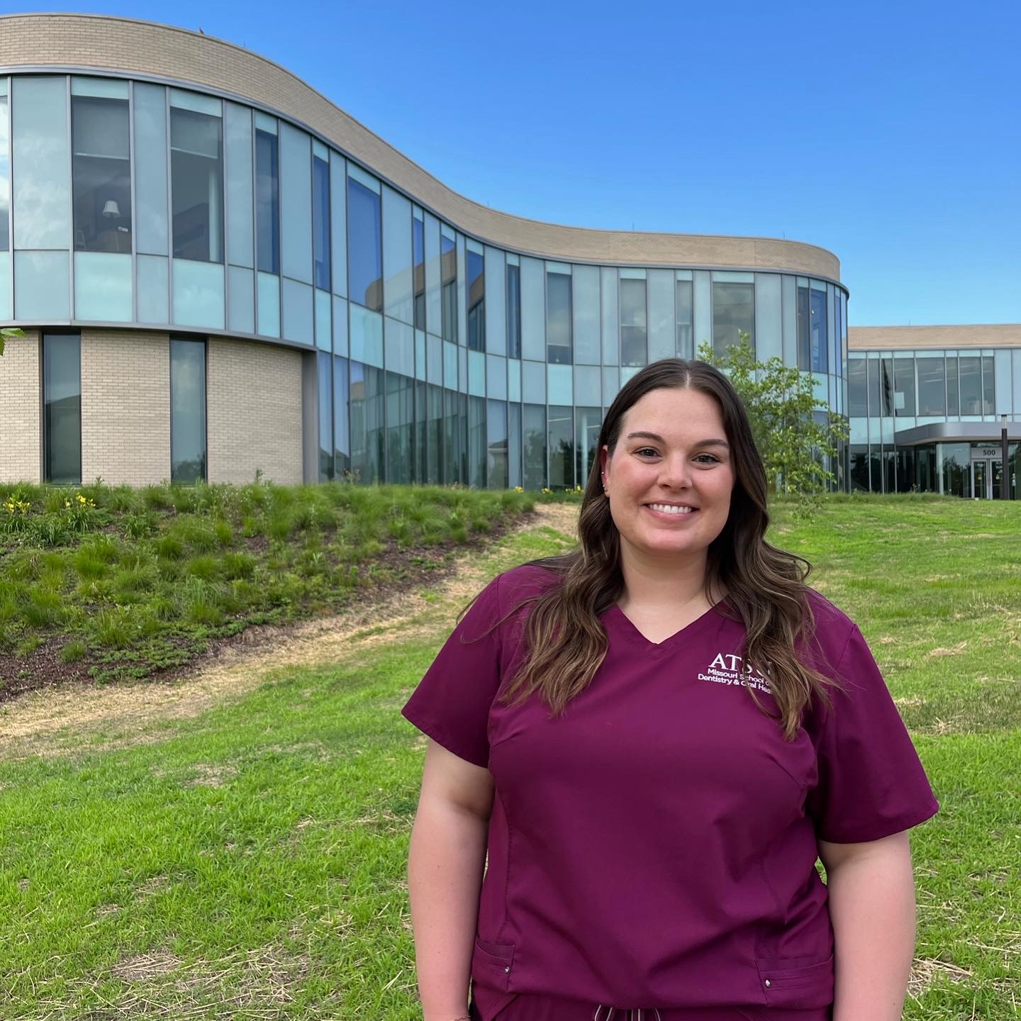 Rachel Johnston, D2, stands in front of the Interprofessional Education Building in Kirksville, Missouri.