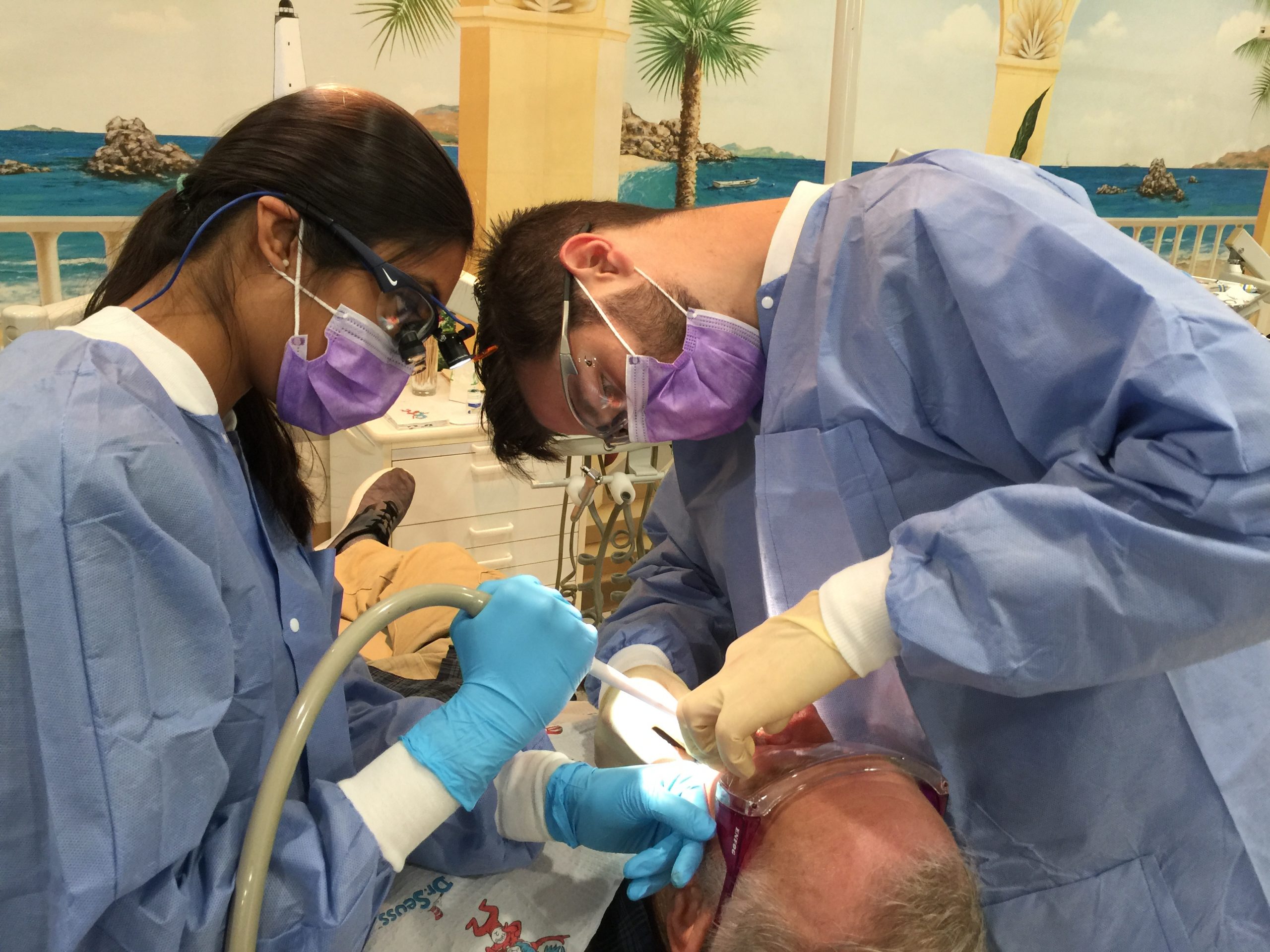 Two ATSU-MOSDOH students provide dental care to a community member in Dexter, Missouri.