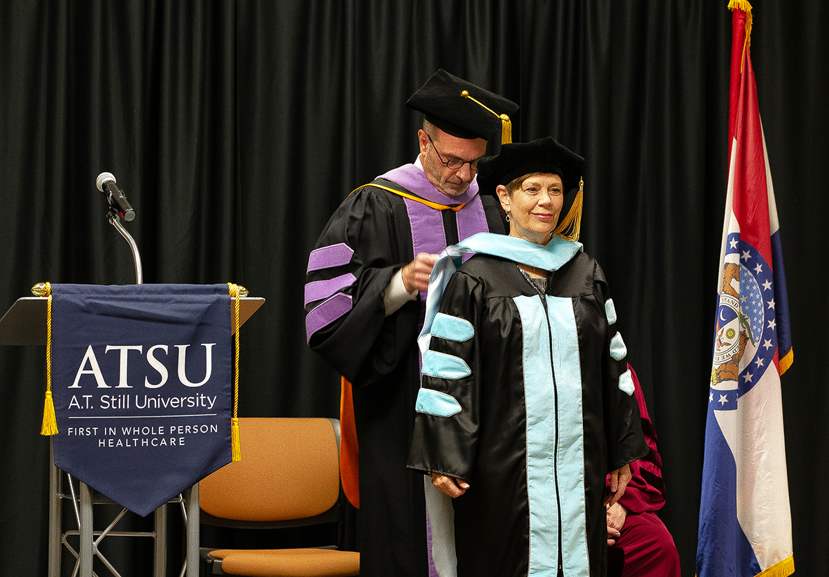 An ATSU-CGHS Doctor of Education in Health Professions student is hooded during her graduation