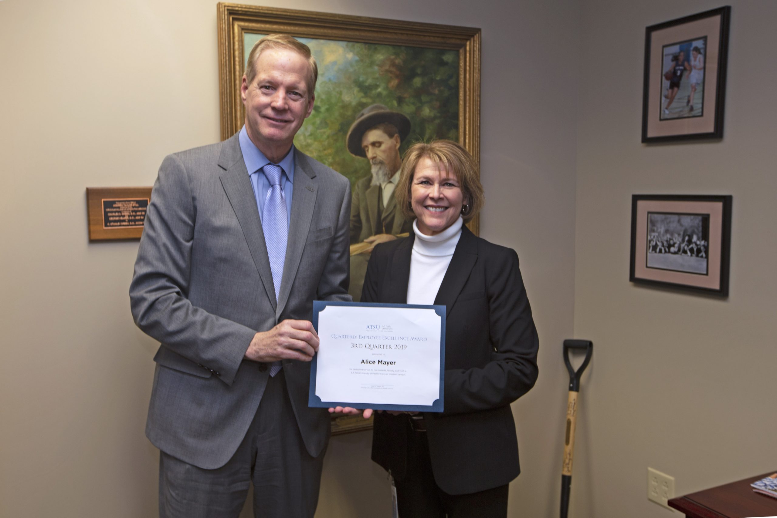 ATSU President Craig Phelps, DO, '84, poses with Alice Mayer, Missouri Campus Employee Excellence Award winner for the third quarter