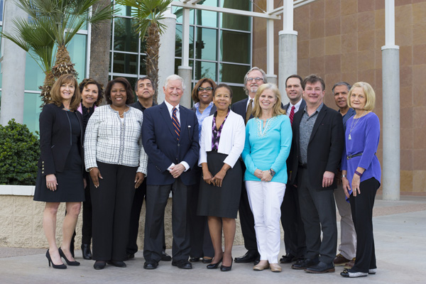 Board members pose for a picture.