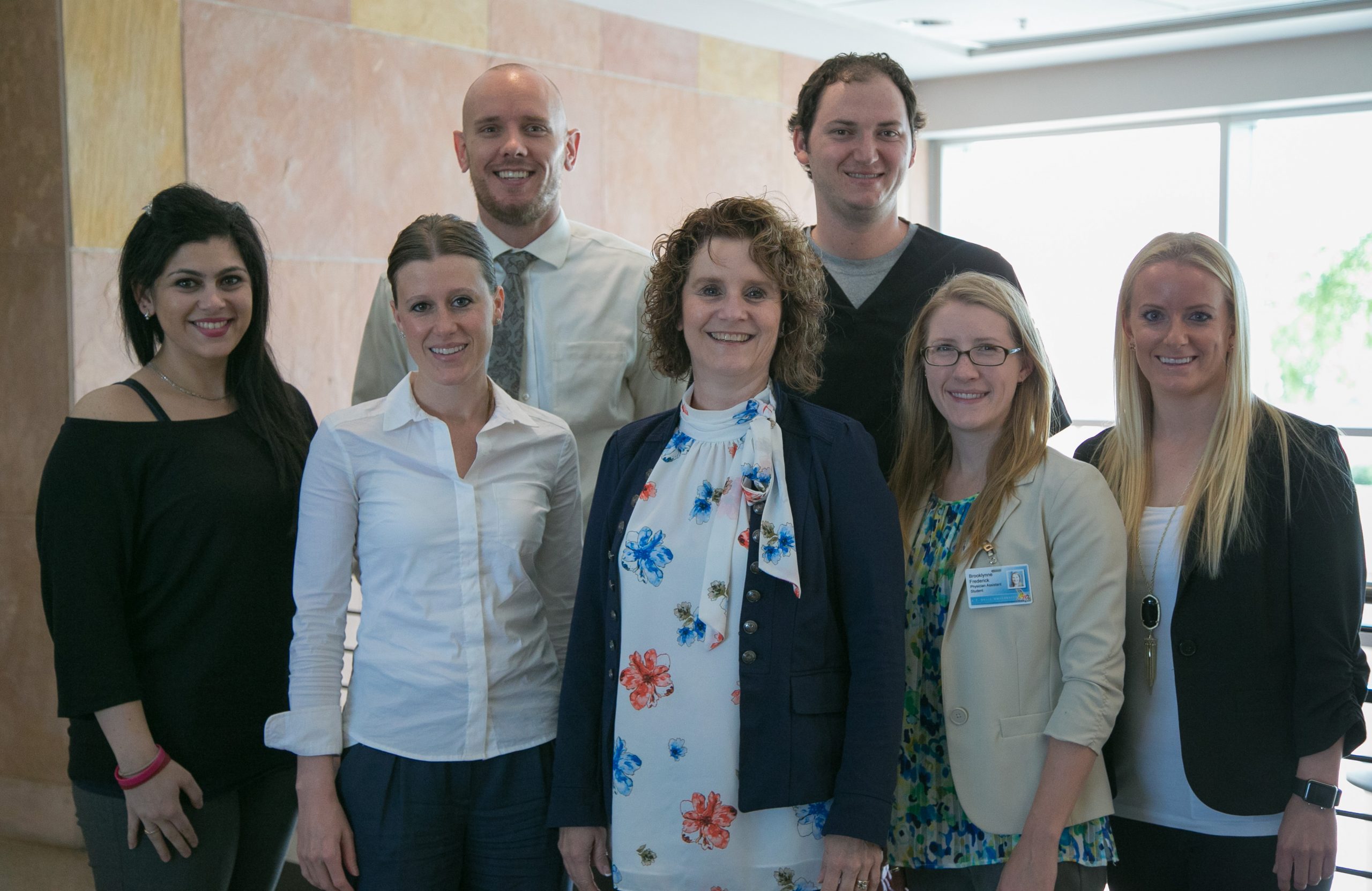 In addition to providing health assessments for the homeless, Dr. DiBaise (center) and her PA students implemented a smoking cessation program at a homeless rehabilitation facility in downtown Phoenix.