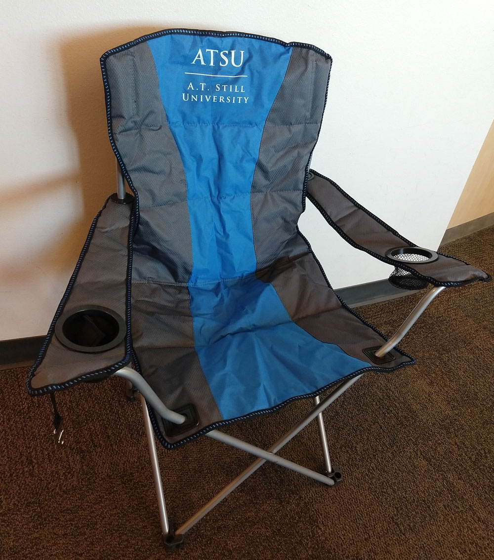a camping-style chair with the ATSU logo