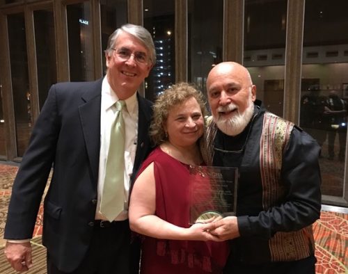 Dr. Jack receives the NNOHA Lifetime Achievement award from Phillip Thompson, executive director, and Dr. Janet Bozzone, president of NNOHA.