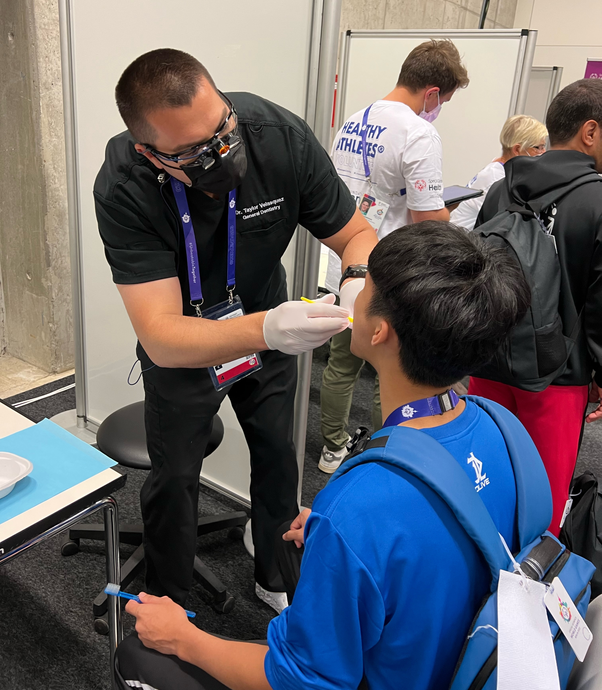 Dr. Taylor Velasquez screens patient athletes at the Special Olympics World Games.