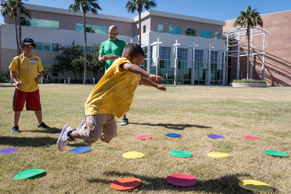 child jumping through game