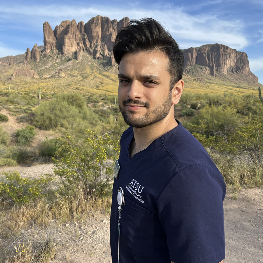 Jainik Patel, D2, stands in front of the Superstition Mountains.