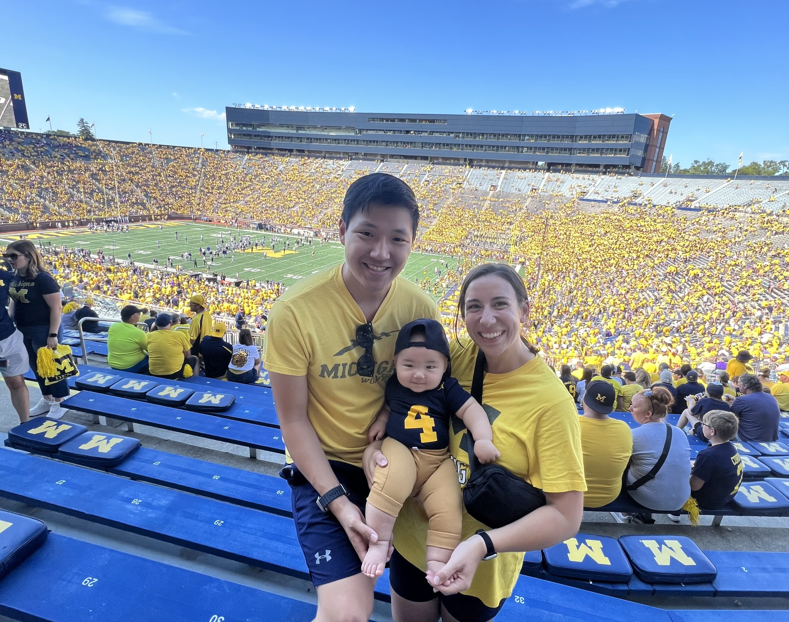 The Byler family poses for a photo in the stands at the University of Michigan football stadium.