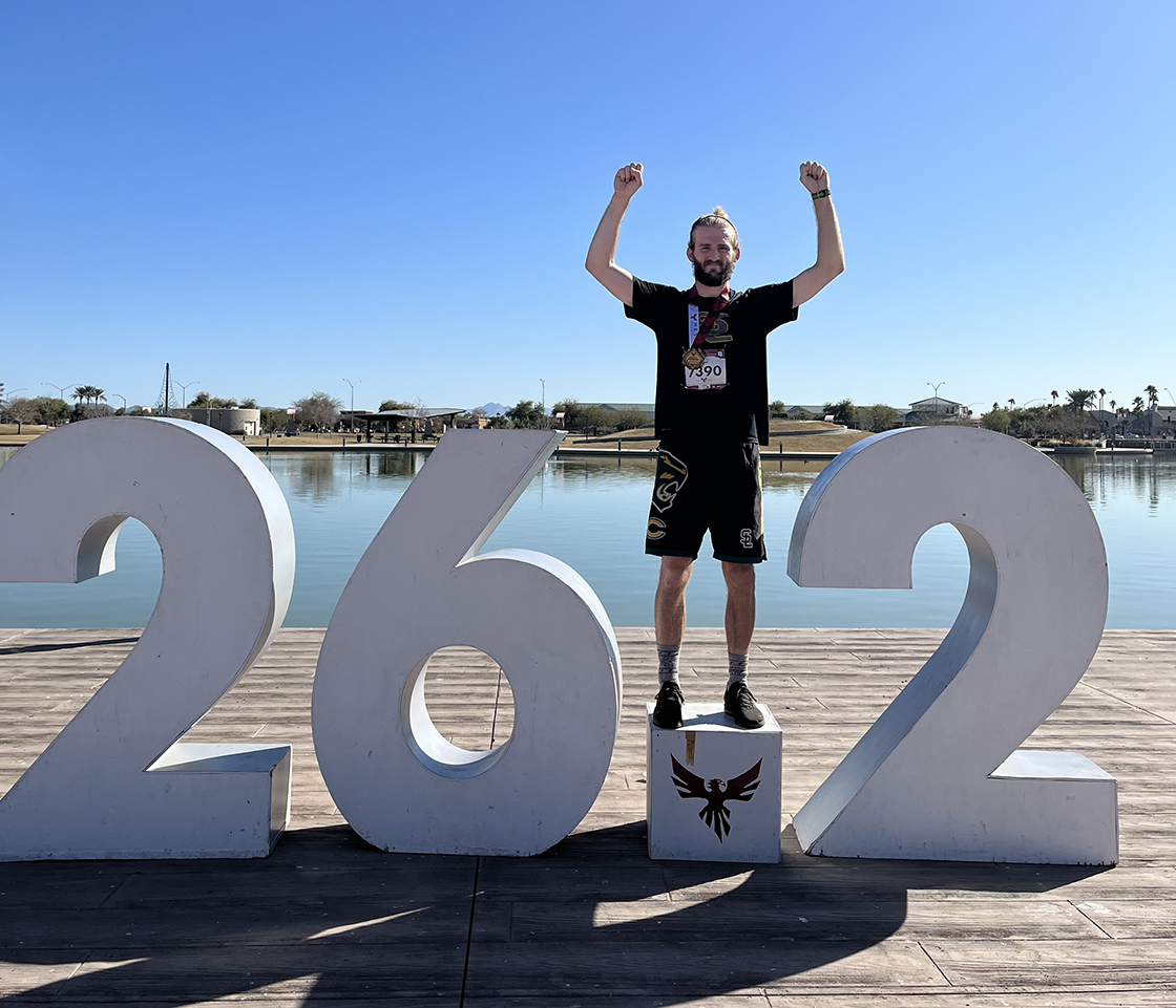 Webb stands above the "dot" in 26.2 miles, following a marathon run.