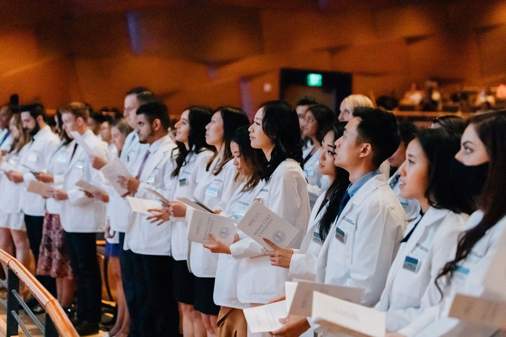 ATSU-ASDOH students read the oath to the profession during their White Coat Ceremony.