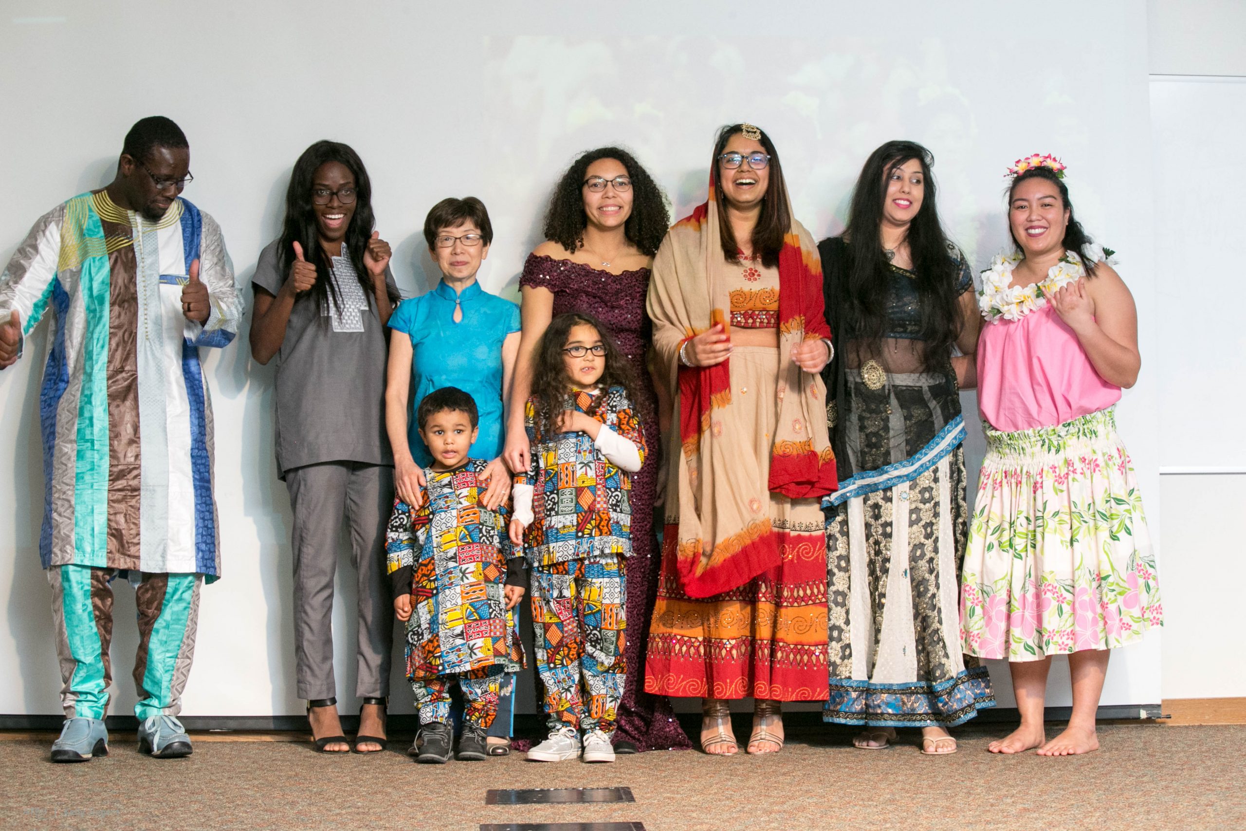 group of people dressed in clothes from various countries