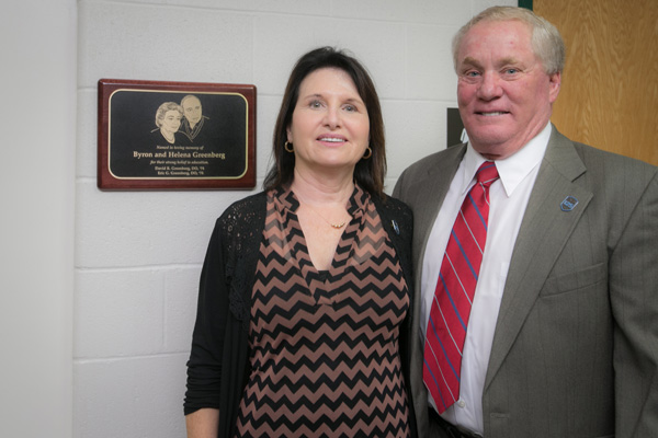 Nancy Greenberg with Dr. David Greenberg in front of plaque.