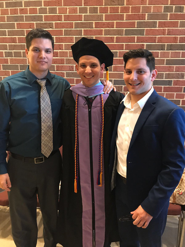 Three brothers at commencement ceremony