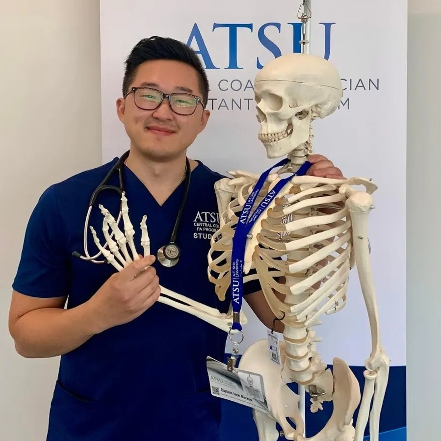 Matthew Chan poses with a skeleton