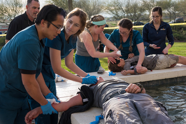 DO students helping simulated patients