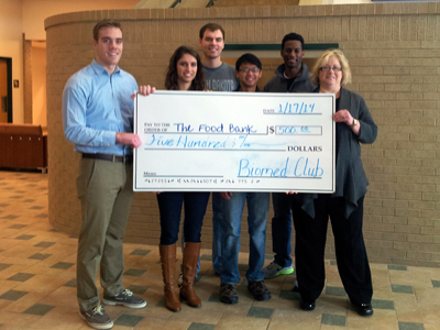 Students present the check to Susan Dublin, regional coordinator, Food Bank for Central and Northeast Missouri.