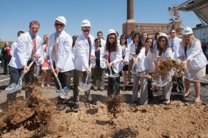 Members of the ATSU-MOSDOH inaugural class turn the soil at the site of the new clinic.