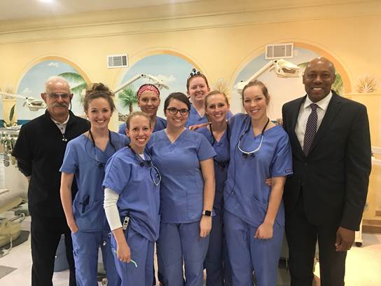 Pictured from left to right: Herbert Silva, DMD; Megan Ott, D3; Theresa Jacquin, D3; Brigid Verhoff, D3; Alyssa Ruopp-Baker, D3; Maryann Forsell, D3; Chelsea Schmitz, D3; Ashton Pargman, D3; ATSU-MOSDOH Dean Dwight McLeod, DDS, MS