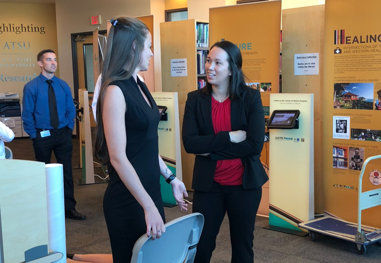 visitors at the Native Voices exhibit at the Arizona branch of the library