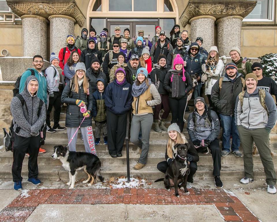 students with backpacks in group photo