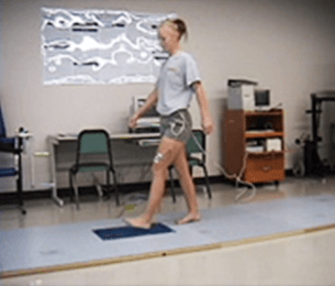 Female ATSU student walking on a force platform.