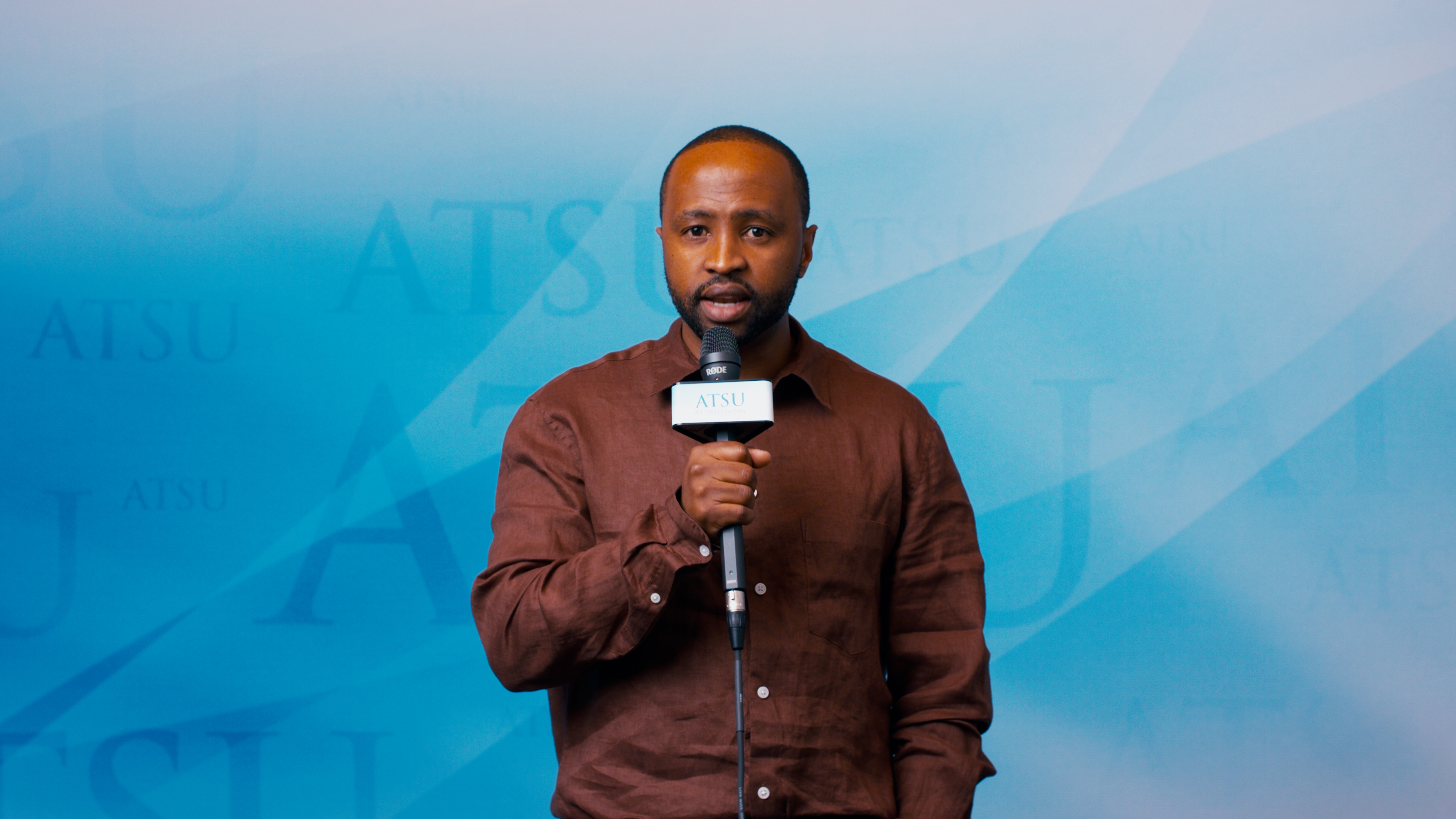 Student speaking into microphone